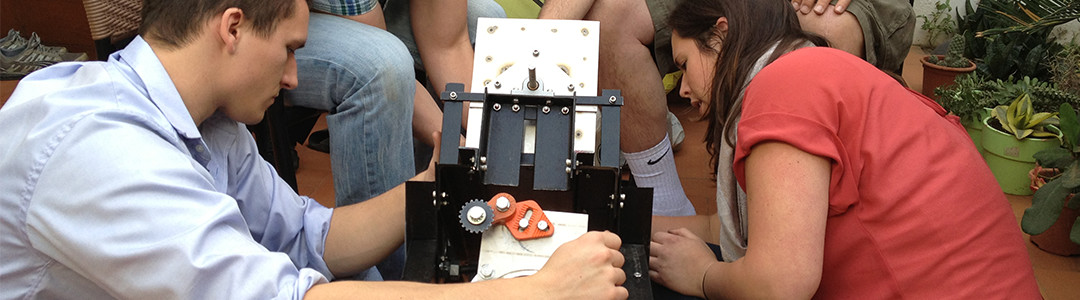 People working on a catapult 