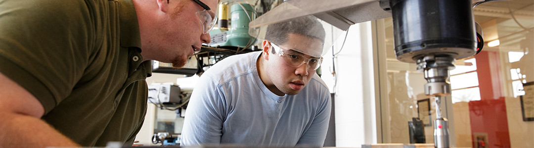 Students working on machine