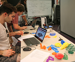 Student using computer software to print 3d objects