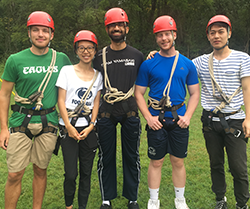 Five people wear protective gear 